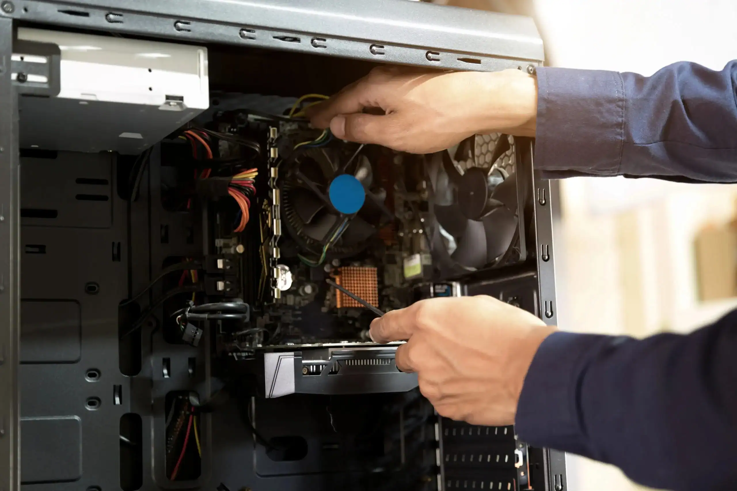 IT technician upgrading computer hardware in Romford for optimal business performance.